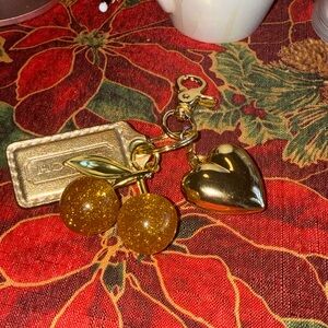 Gold Cherry Coach purse charm with heart